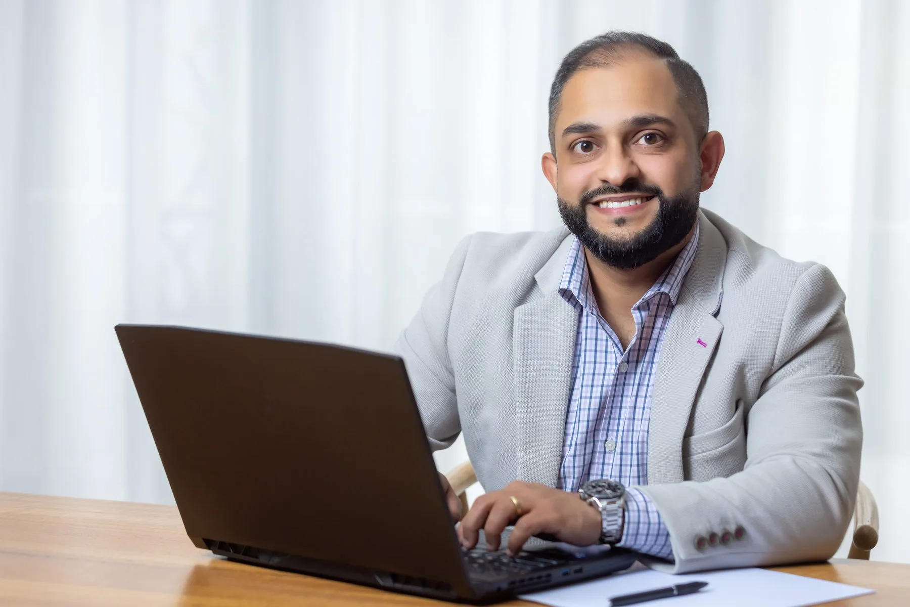 Manraj Singh working at his desk
